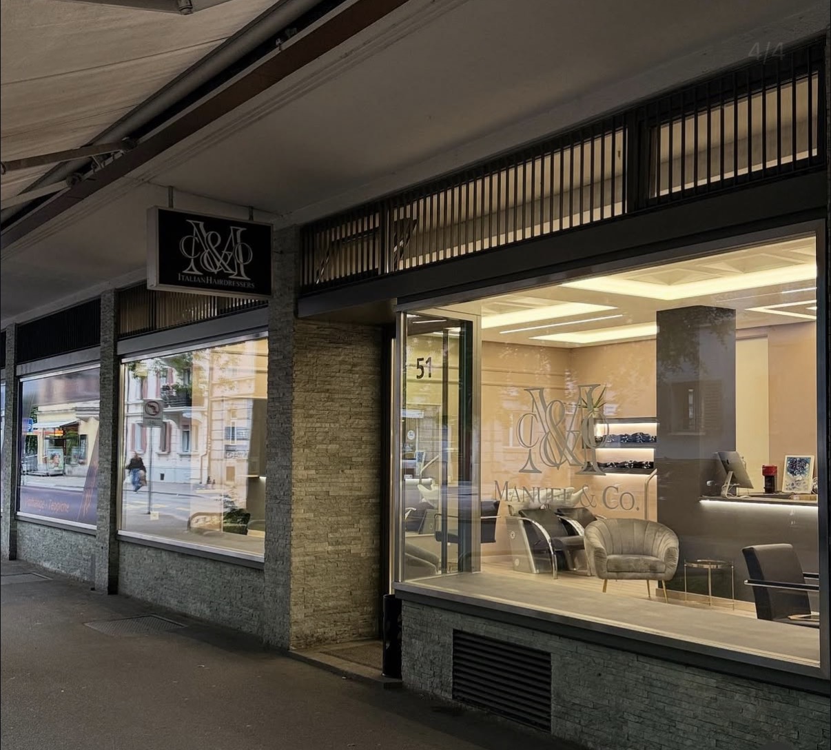Manuel & Co. storefront at night